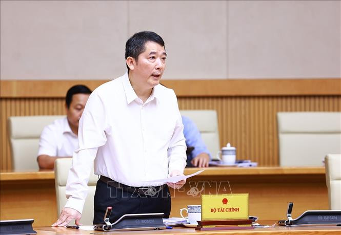 Thứ trưởng Bộ Tài chính Cao Anh Tuấn trình bày Tờ trình tóm tắt về Dự án Luật Quản lý và đầu tư vốn nhà nước tại doanh nghiệp (sửa đổi) Chú thích ảnh